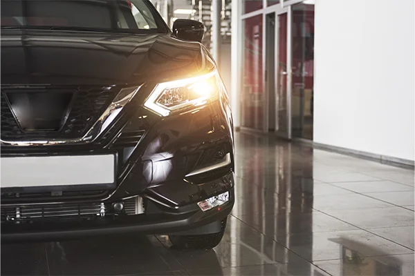 black Nissan on showroom floor