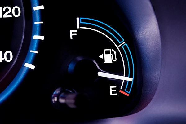 Fuel gauge on dash showing low fuel level